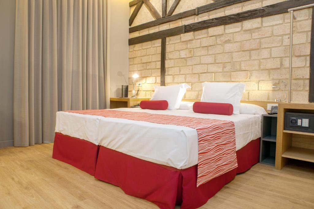 Postel nebo postele na pokoji v ubytování Soho Boutique Capuchinos & Spa