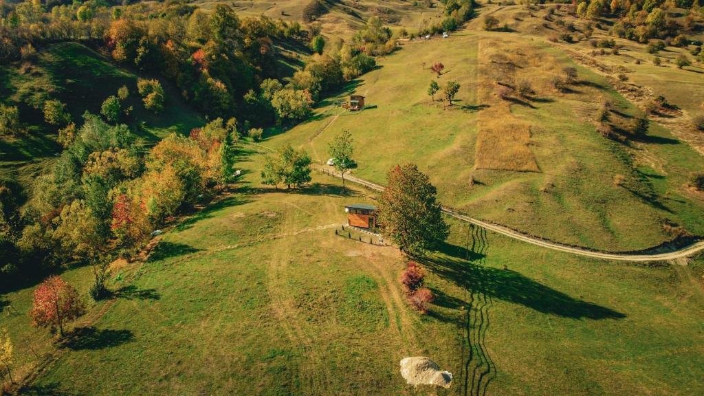 an aerial view of a field with a house on it at NorAtlas Heritage - Adults Only in Varlămul