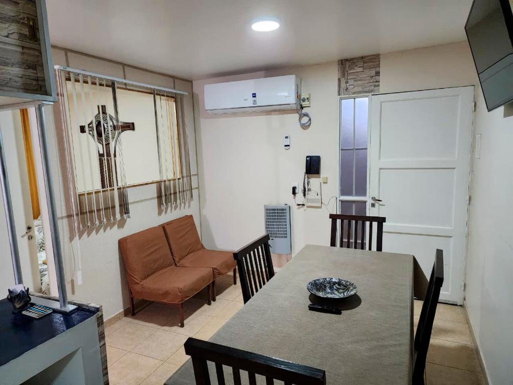 a living room with a table and a couch at Dptos en Consorcio Florentino in San Juan