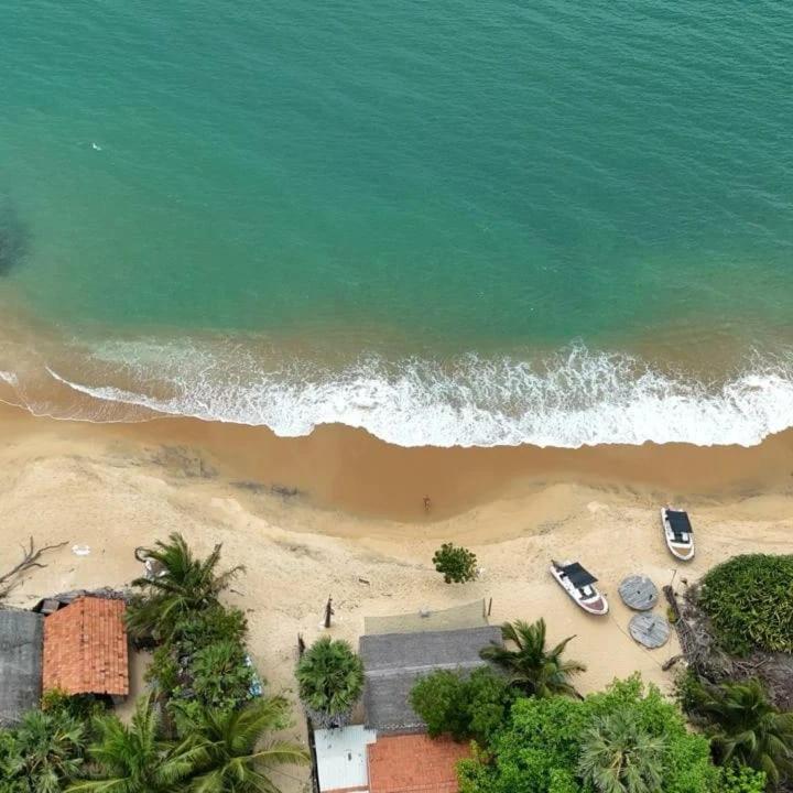 an overhead view of a beach with cars parked on it at Ocean & Beach kite Hotel in Kalpitiya