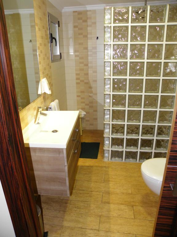 a bathroom with a sink and a toilet at Hotel Noguera El Albir in Albir