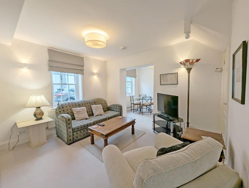 a living room with two couches and a tv at 1a Tower Street - Emsworth in Emsworth