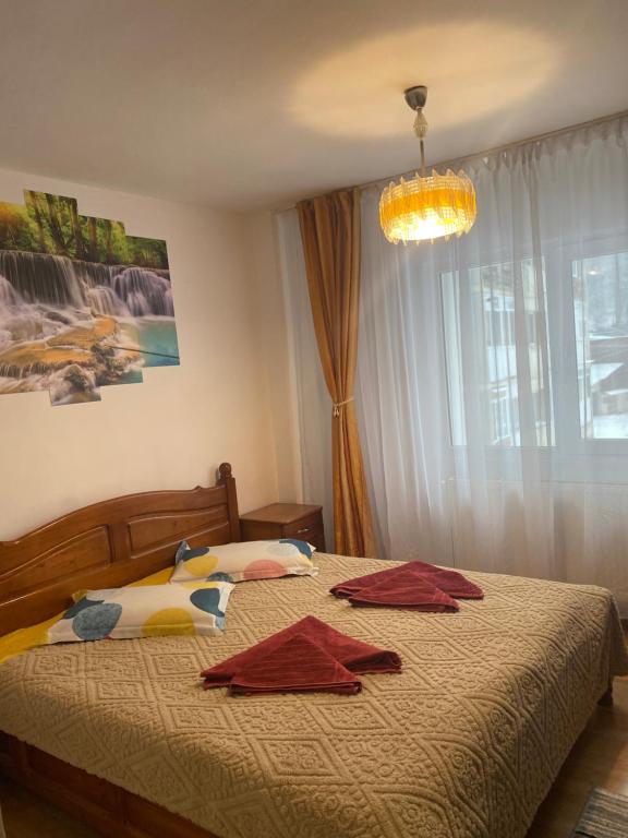 En eller flere senge i et værelse på Apartament Maria