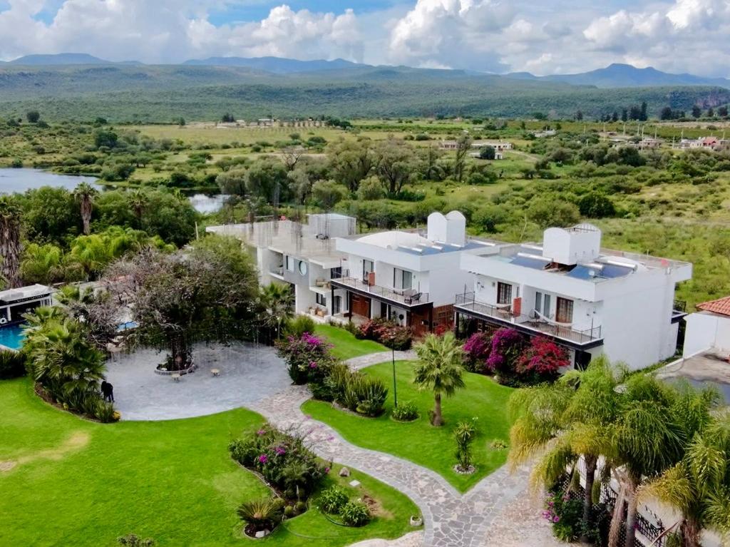an aerial view of a large white house with a yard at Yolihuani Relax Resort in Calvillo
