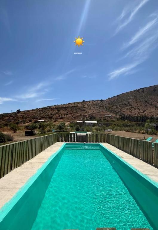 a swimming pool with a volley ball in the sky at Cabañas Montesol Mejor Vista a las estrellas in Choapa