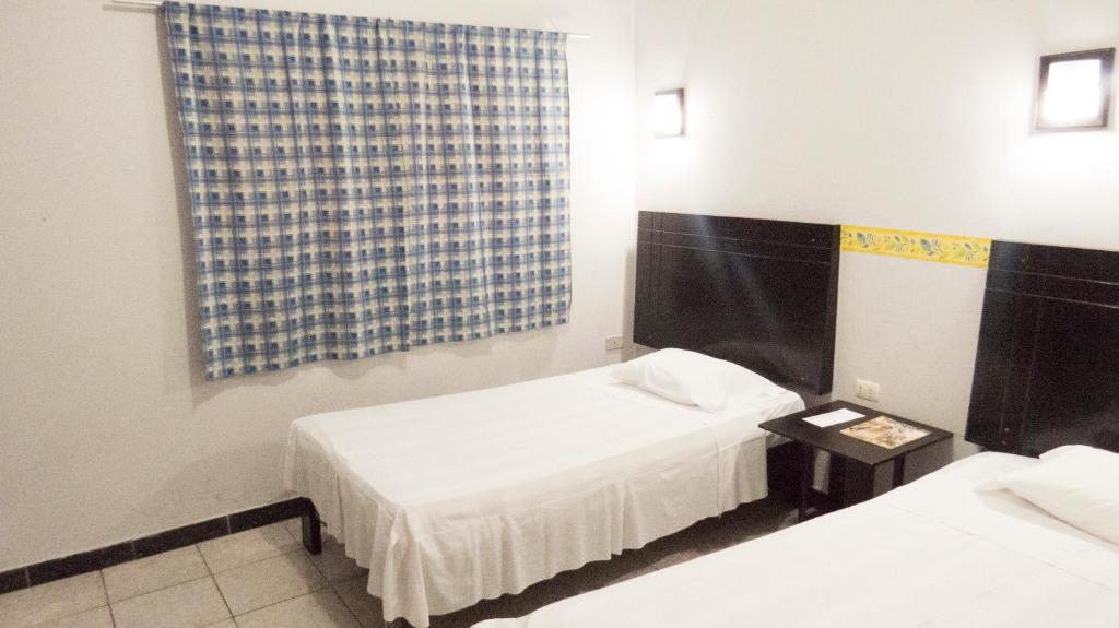 Postel nebo postele na pokoji v ubytování Jer`s Hostal