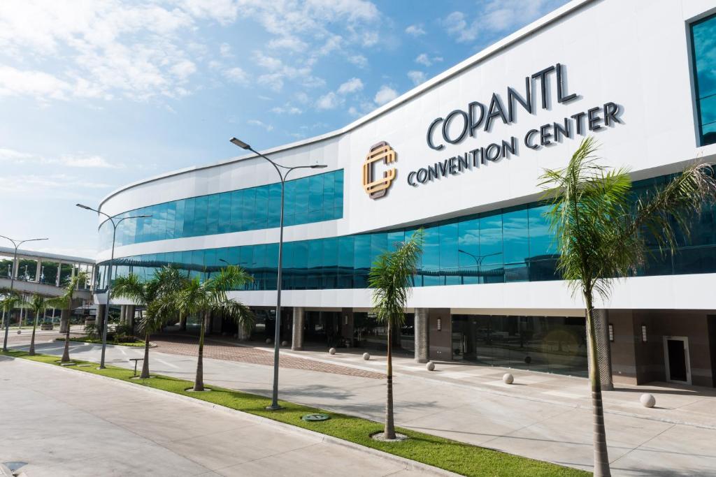 a building with a sign on the side of it at Copantl Hotel & Convention Center in San Pedro Sula