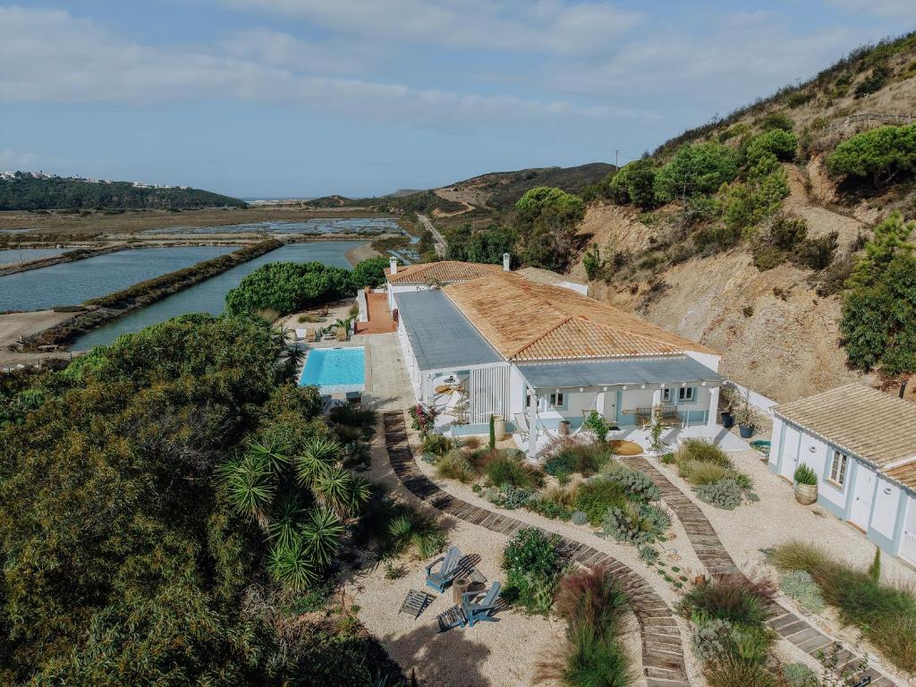 an aerial view of a house next to a river at Herdade d'Amoreira Jasmin Villa in Aljezur