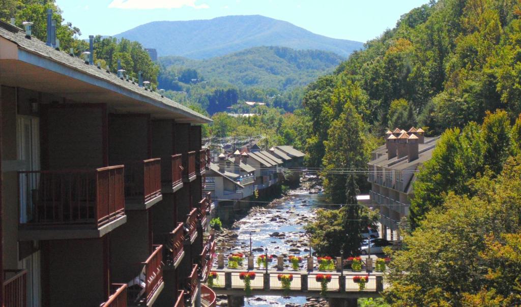 a view of a river from a balcony of a building at Baymont by Wyndham Gatlinburg On The River in Gatlinburg
