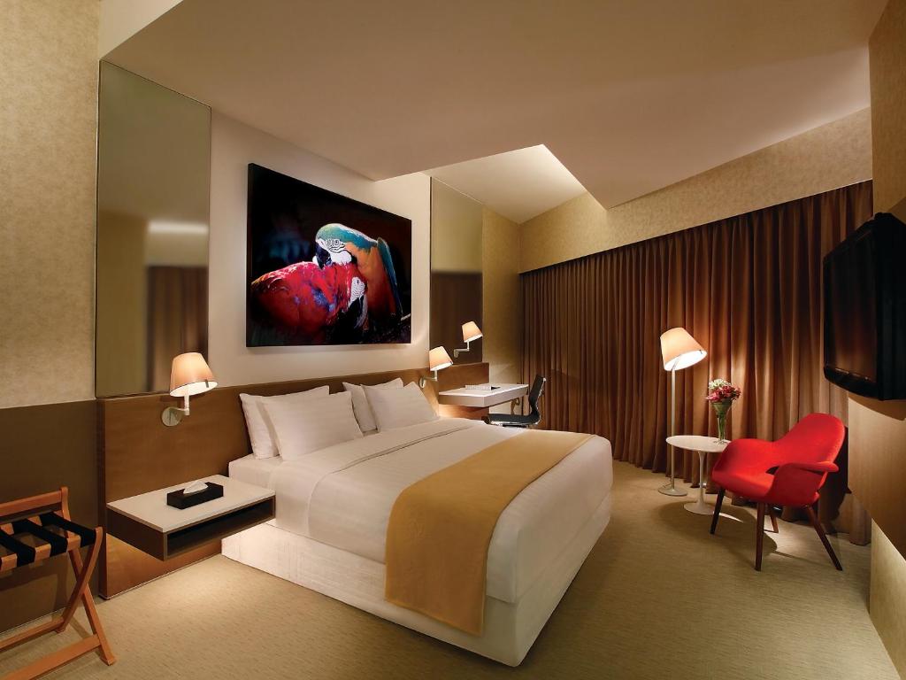 Postel nebo postele na pokoji v ubytování D'Hotel Singapore managed by The Ascott Limited