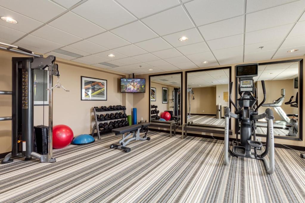 a fitness room with a gym with exercise equipment at Park Inn by Radisson, Calgary Airport North, AB in Calgary