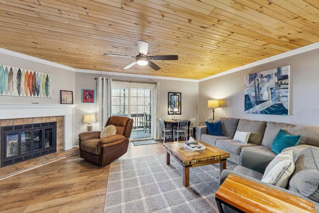 a living room with a couch and a fireplace at Cloud Nine Mountain Home in Sugar Mountain