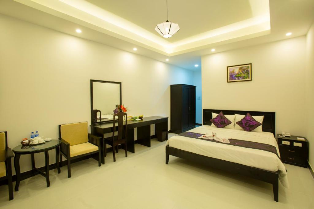 Cama o camas de una habitación en Hoi An Hideaway Villa