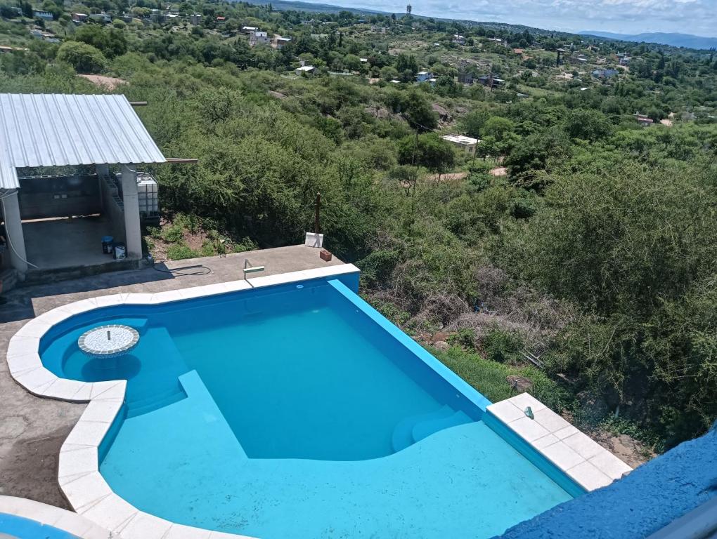 an overhead view of a blue swimming pool at Los Talitas in Villa Parque Siquiman
