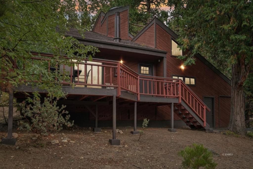 a house with a staircase leading up to a house at Idyllwild Realty Vacations in Idyllwild