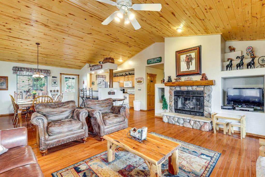 a living room filled with furniture and a fireplace at Hike, Fish & Enjoy Pond On-Site: Bison Ranch Cabin in Overgaard