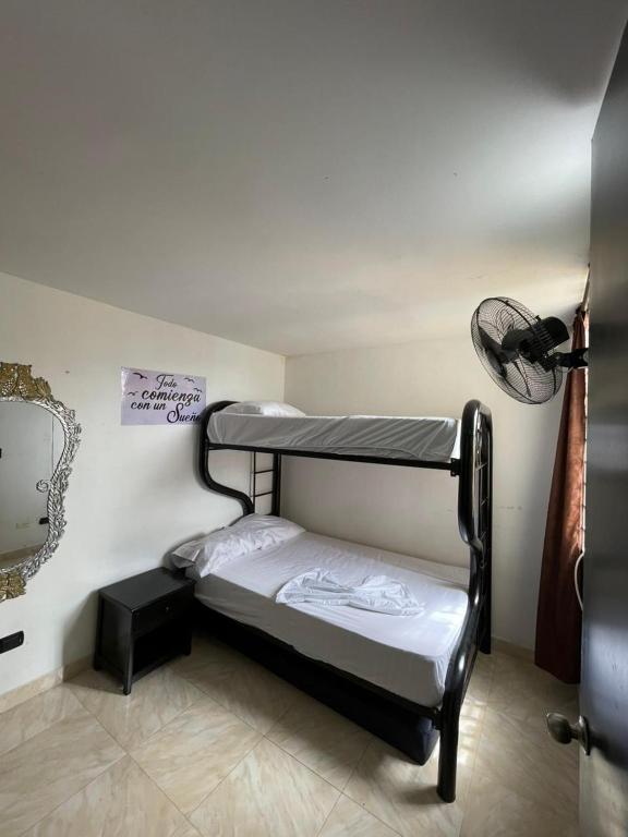 a small room with a bunk bed in it at Suite María Paula in Colombia
