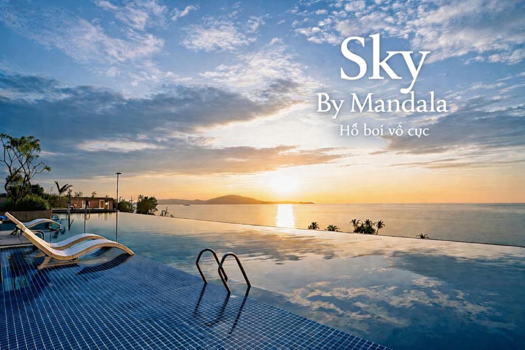 a swimming pool with a view of the ocean at Sky By Mandala's Mũi Né in Phan Thiet