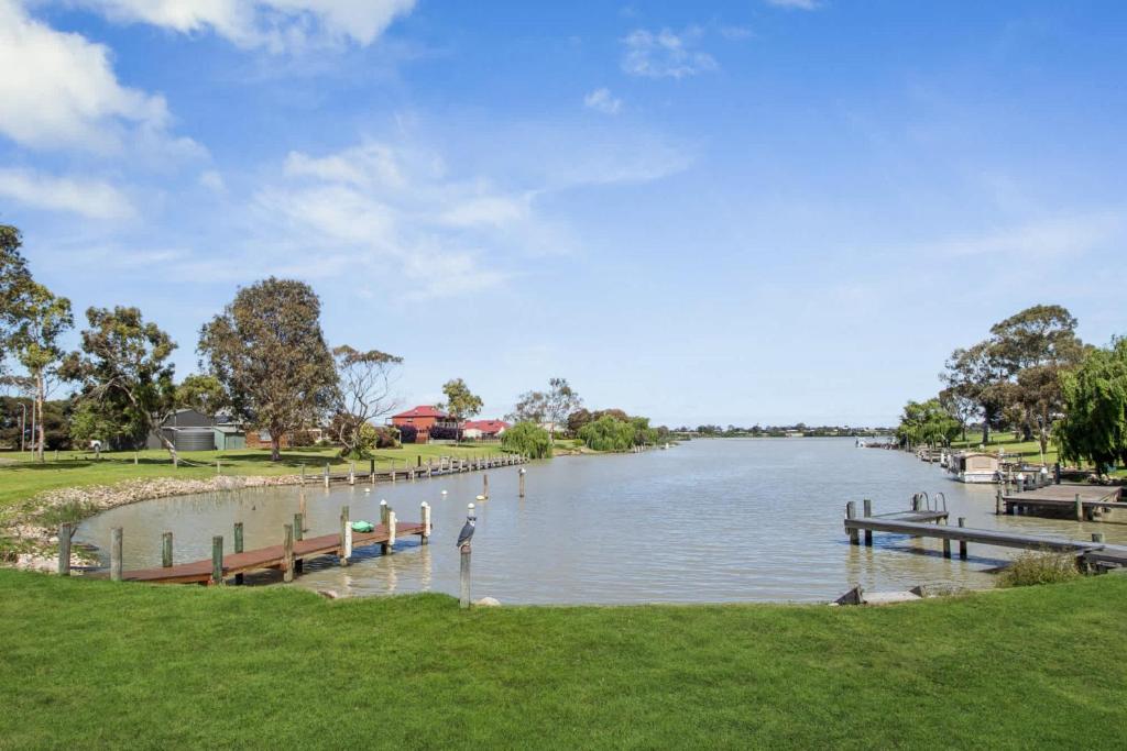 a river with a dock in the middle of it at Wellington Waters in Wellington East