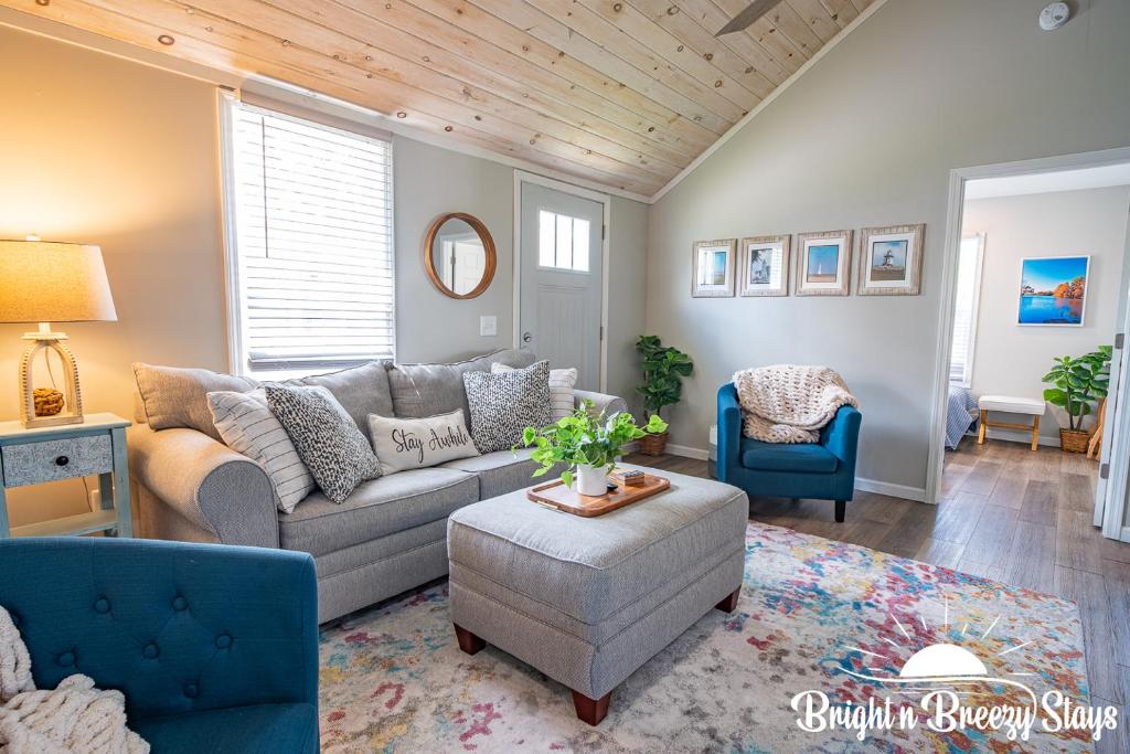 a living room with a couch and two chairs at Renovated Retreat Home in Huron, close to beaches in Huron