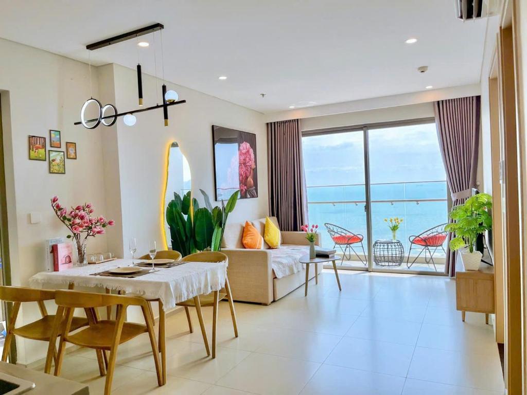 a living room with a couch and a table at The sóng Remy Apartment in Vung Tau