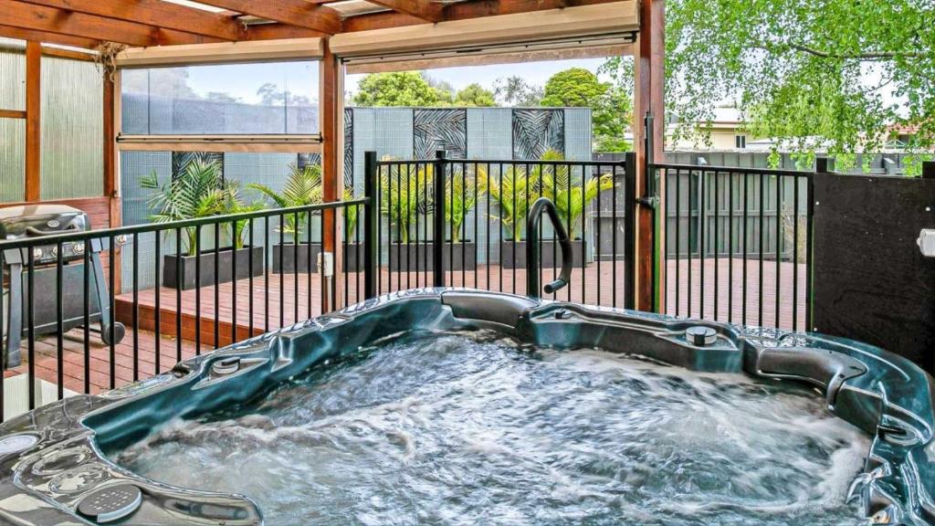 a hot tub in the middle of a house at The Resort at 222 in Cowes