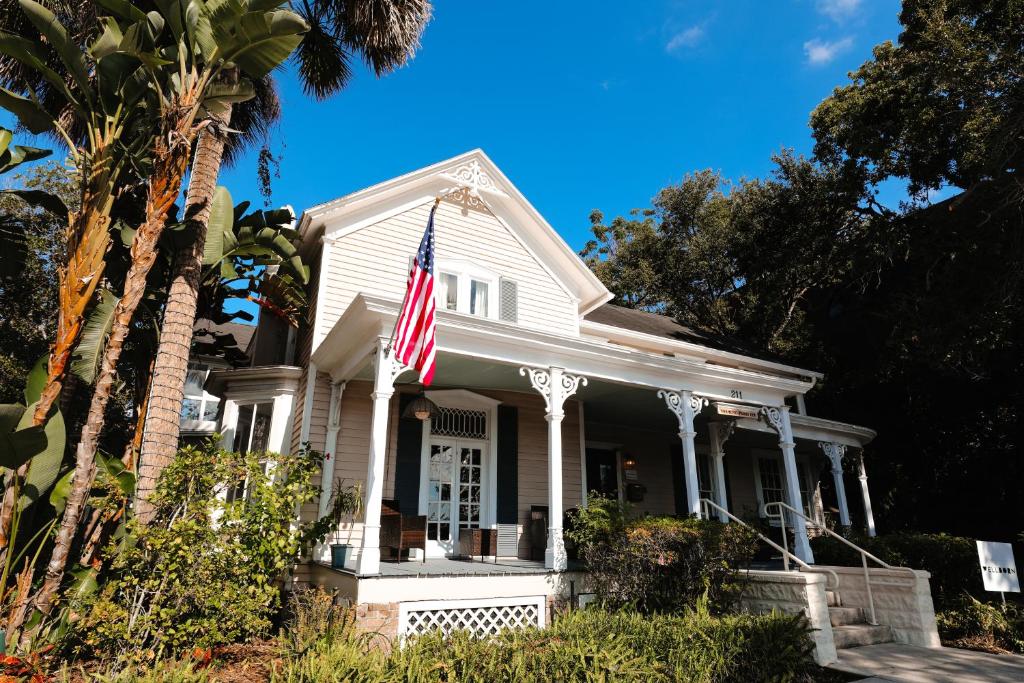a white house with an american flag on it at Norment Parry by The Wellborn in Orlando