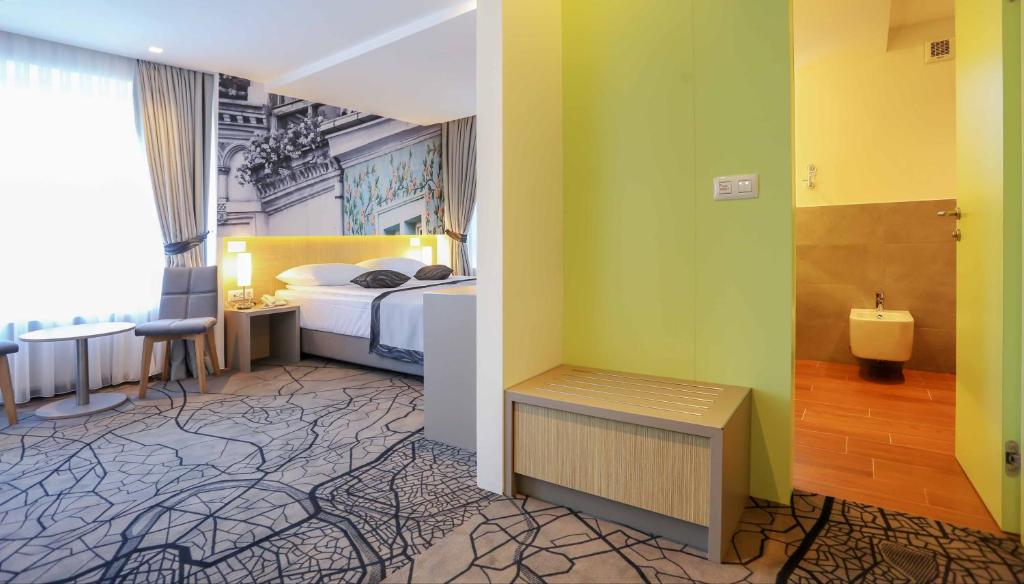 Postel nebo postele na pokoji v ubytování Hotel Grad
