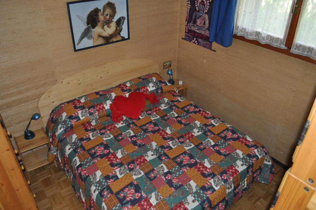 A bed or beds in a room at Rustico nel complesso Chapelle