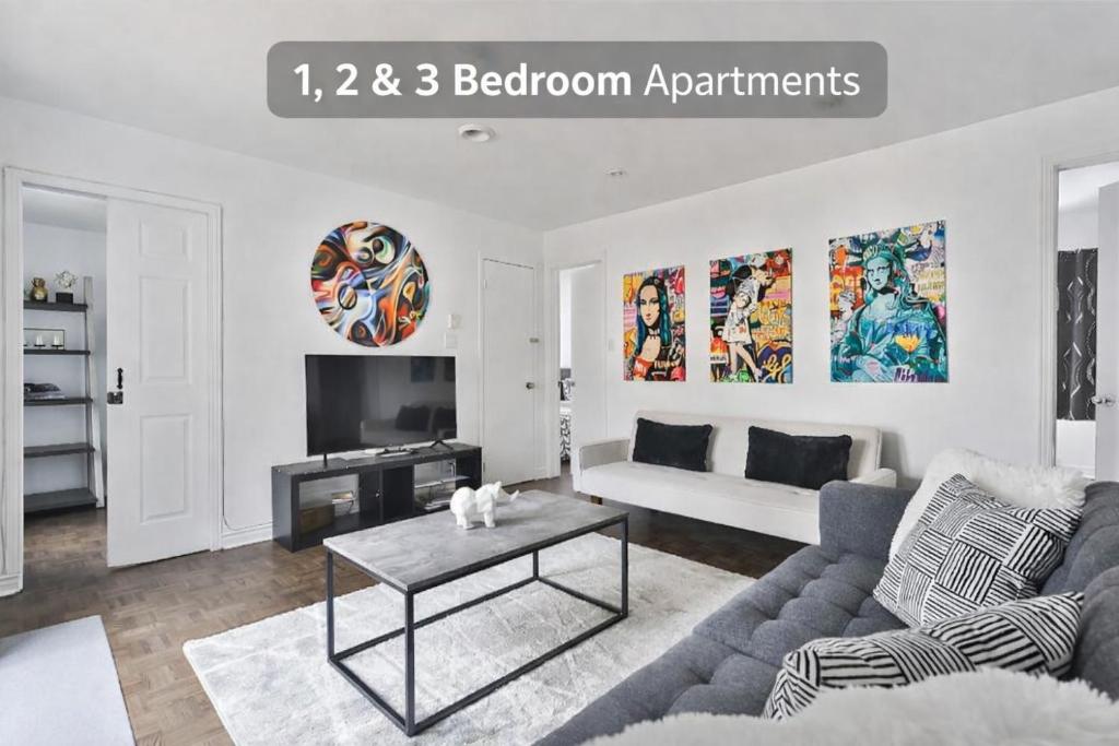 a living room with a couch and a table at FREE PARKING - 5 minute walk to METRO STATION Berri Uqam - In-Suite WASHER & DRYER - fully stocked KITCHEN - WORKSPACE PROVIDED - FAST WIFI in Montréal