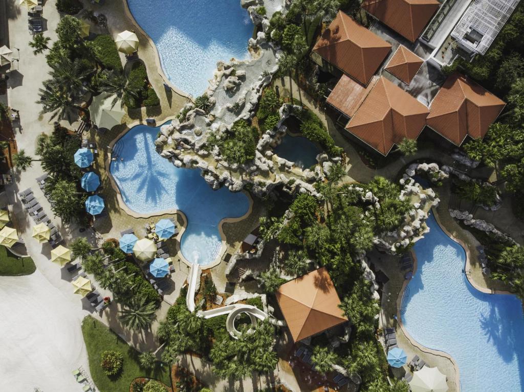 an overhead view of a resort with swimming pools at Hyatt Regency Grand Cypress Resort - Free Shuttle to Theme Parks! in Orlando