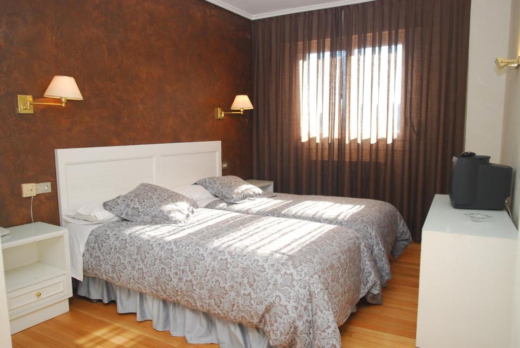 Giường trong phòng chung tại Hotel Iguareña