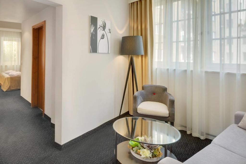 Postel nebo postele na pokoji v ubytování Hotel Clement