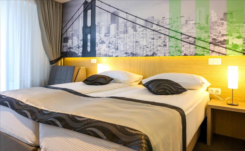 Postel nebo postele na pokoji v ubytování Hotel Grad