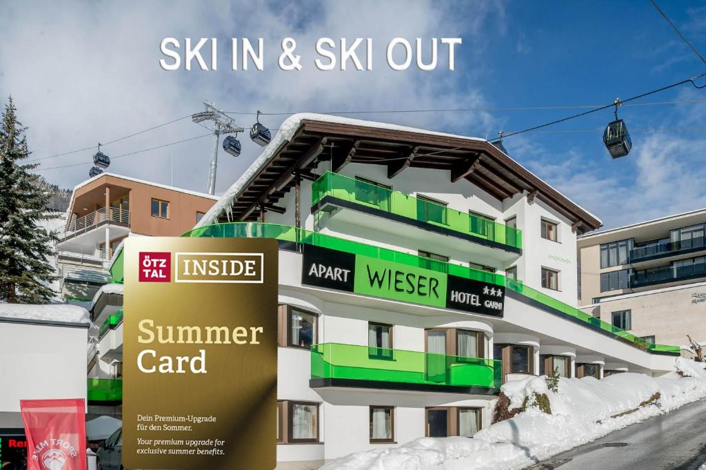 a building with a sign in front of it at Apart Hotel Garni Wieser in Sölden