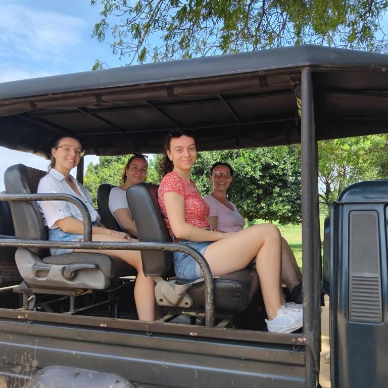 a group of people sitting in the back of a jeep at Gramatic Cottage Udawalawe in Udawalawe