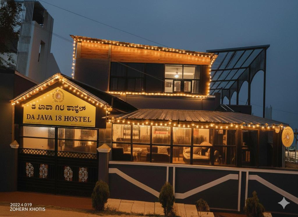 a building with lights on the front of it at Da Java 18 hostel and Homestay Chikmagalur in Chikmagalūr