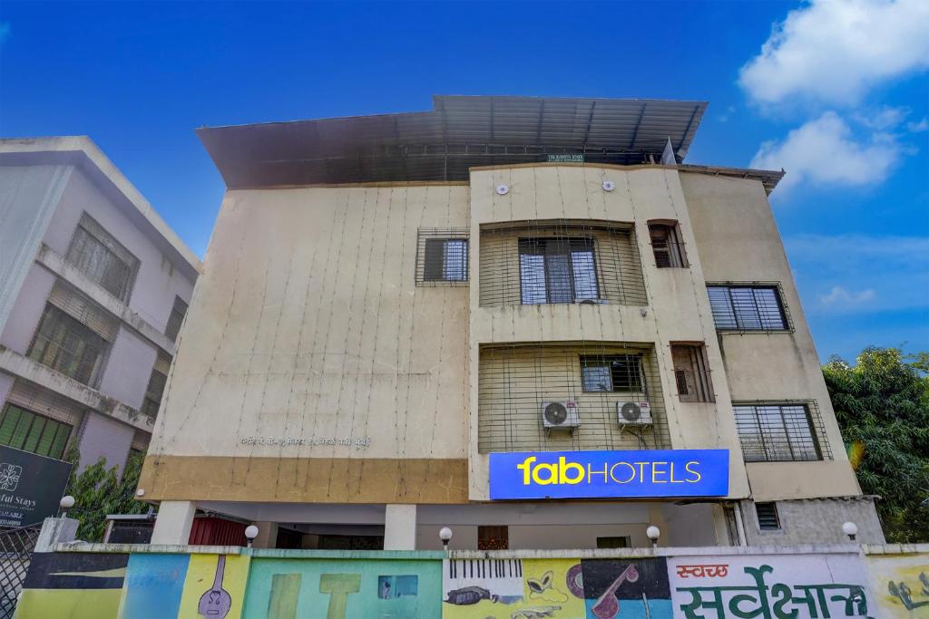 a building with a sign on the side of it at Via Blissful Stays in Mumbai
