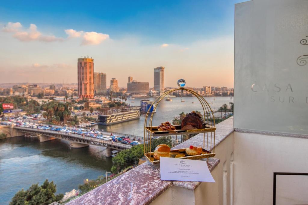 a balcony with a view of a river at Casa Figueroa - Boutique Hotel- Adults Only in Cairo