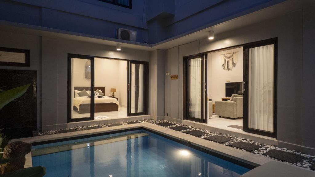 a swimming pool in a house with a bedroom at 3BR Private Pool Villa in Central Seminyak - Walk to Cafés & Shops in Seminyak