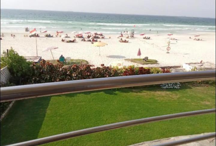 a beach with a lot of people on it at Chalet On the Beach in Alexandria