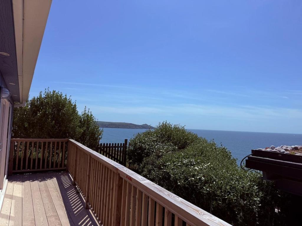 a balcony with a view of the ocean at Recently renovated beach shack with a view in Antony