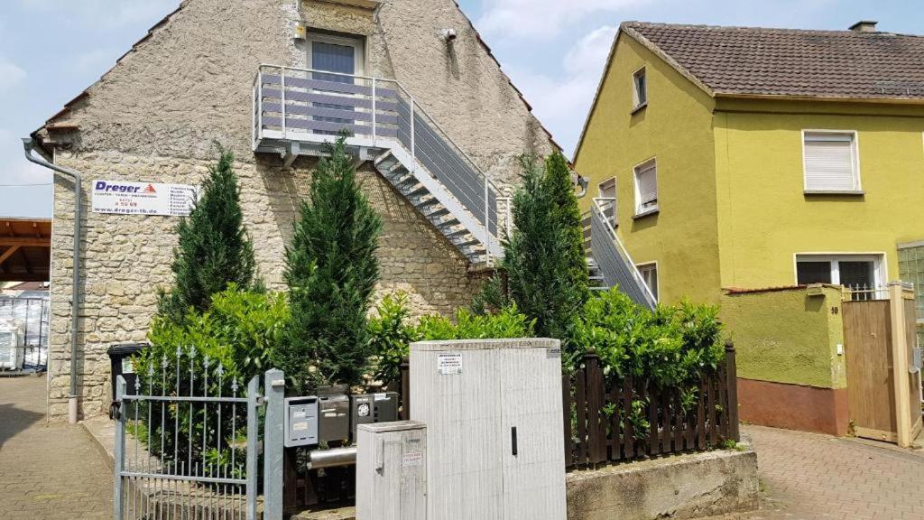 a house with a balcony on the side of it at Apartment in Freimersheim