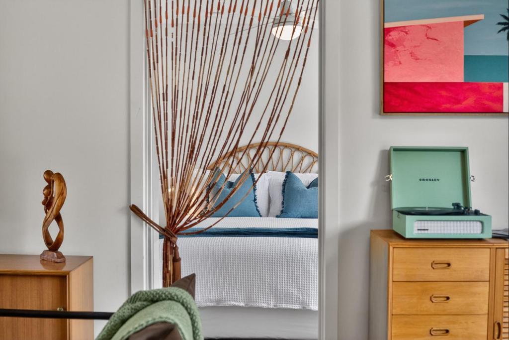 a room with a door leading into a bedroom at Sixty at Yellow Doors in Goolwa South