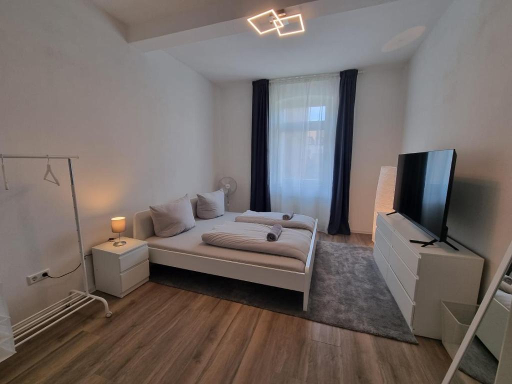 a living room with a couch and a flat screen tv at Süße Marie 9 in Karlsruhe