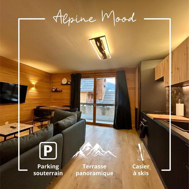 a living room with a couch and a kitchen at Alpine Mood - Vue - Balcon - Parking in Uvernet