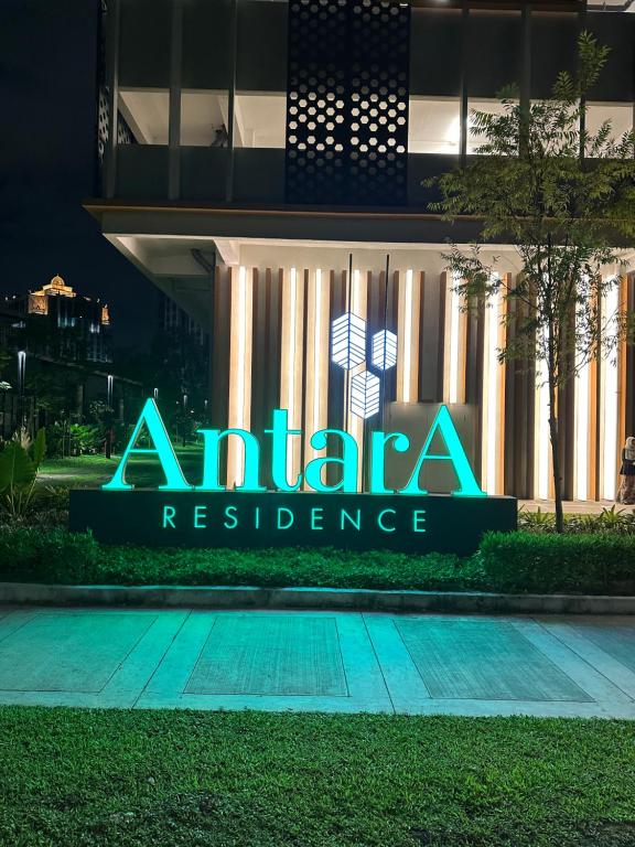 a sign for anahana residence in front of a building at Putrajaya Antara Residence, Near PICC, Presint 5 in Putrajaya