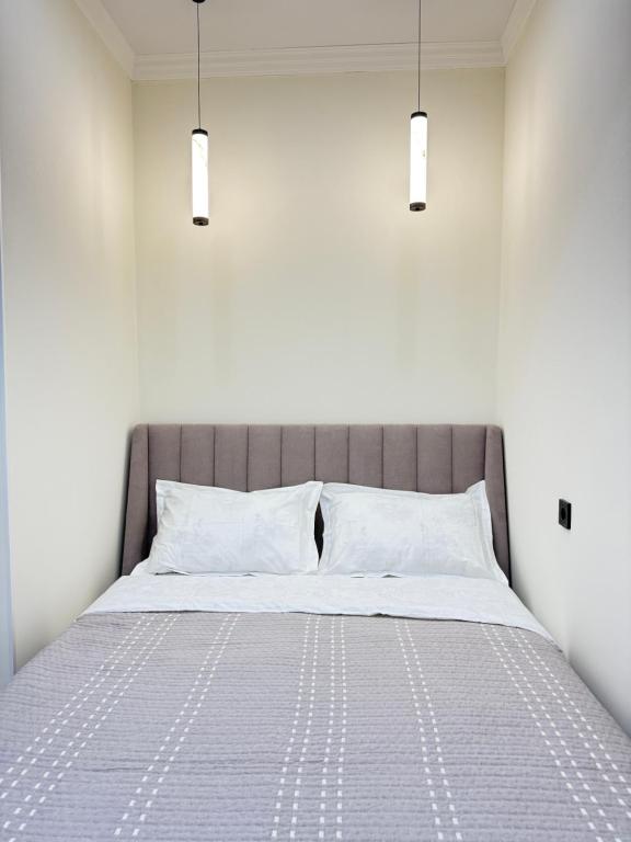 Llit o llits en una habitació de Calm Cotton