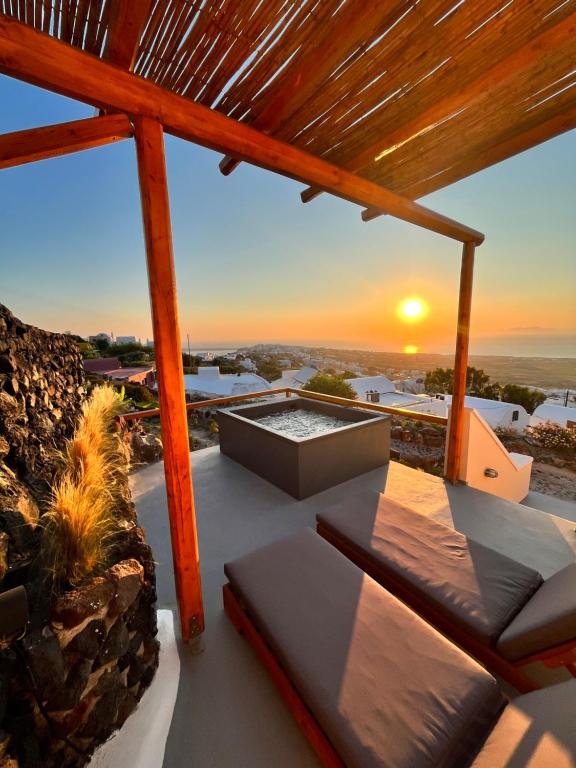 a view of a sunset from the deck of a house at Sunset Paradise Oia in Oia