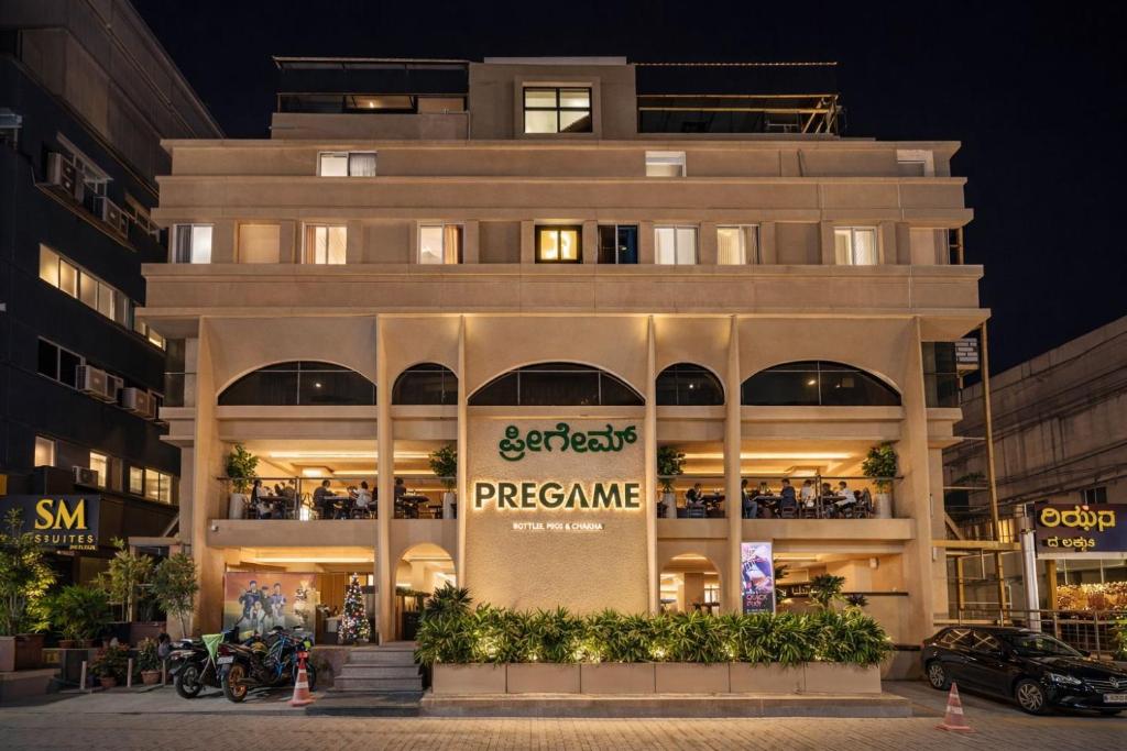 a store front of a building at night at Hotel Rism Suites Koramangala in Bangalore